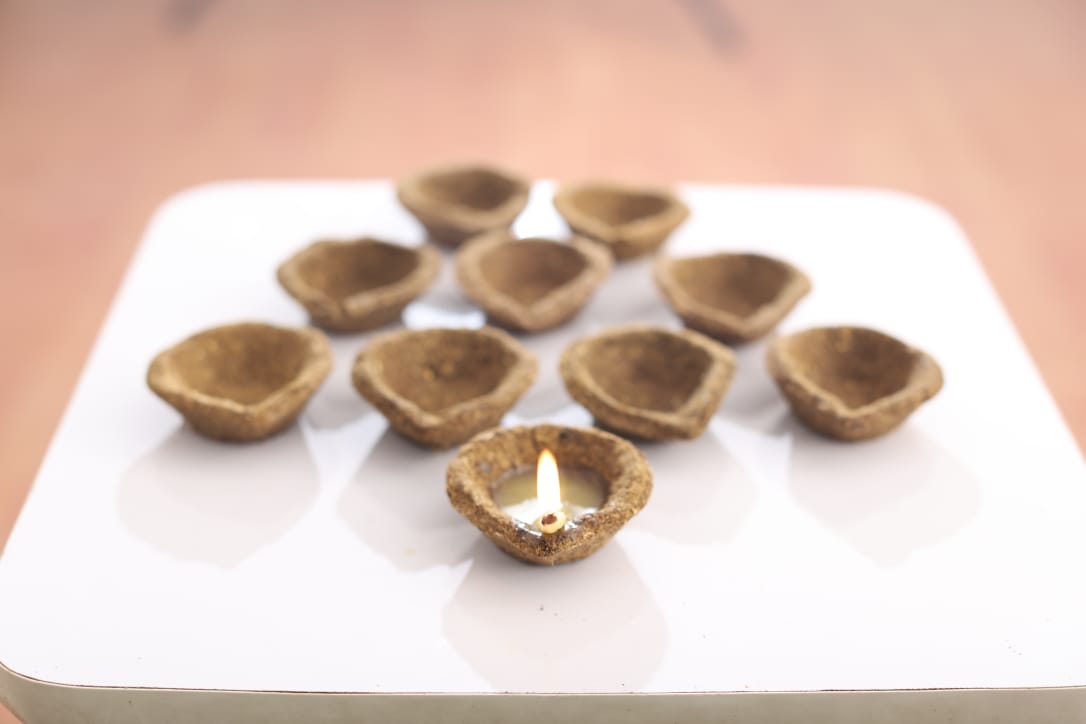 Cow dung diyas, one lit for evening pooja
